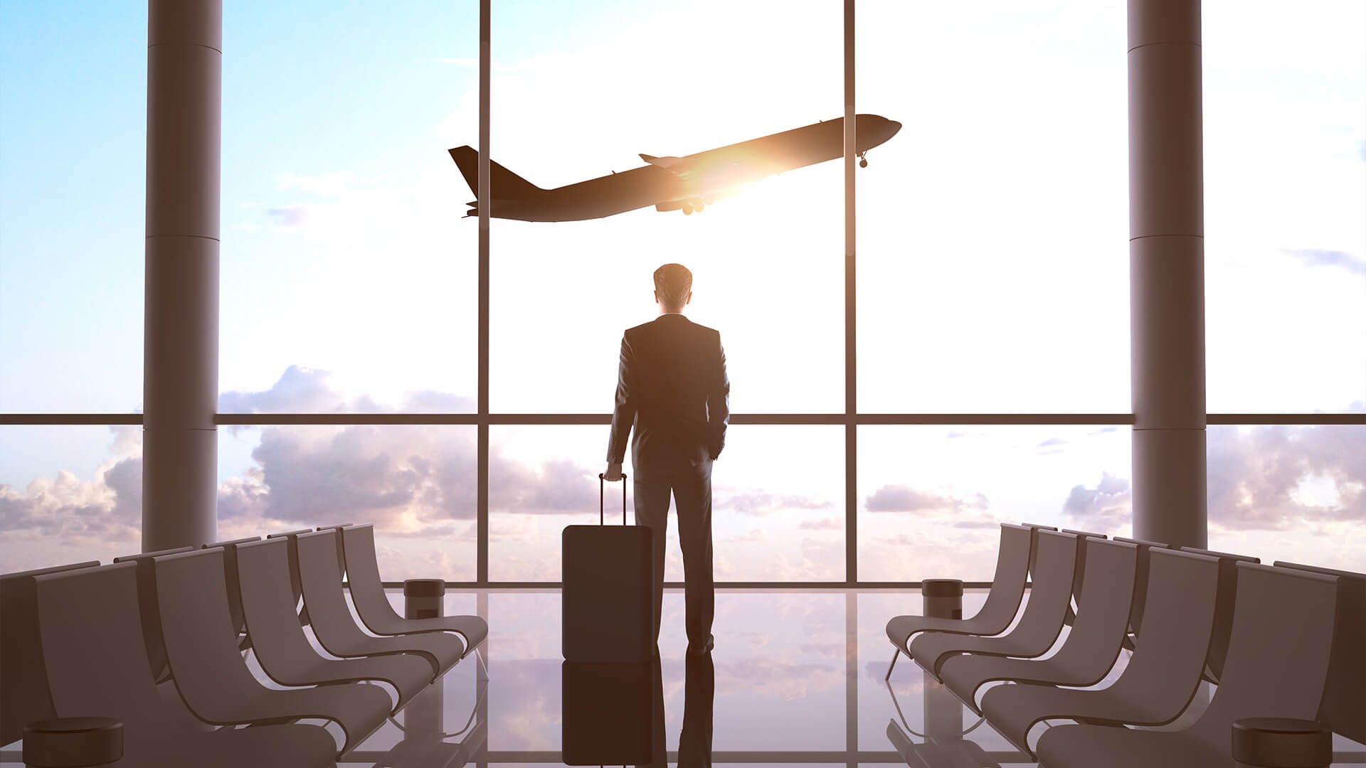 hanse business travel geschaeftsreisen servicegedanke silhouette mann vor fenster abflug terminal